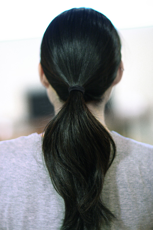 black hair in ponytail
