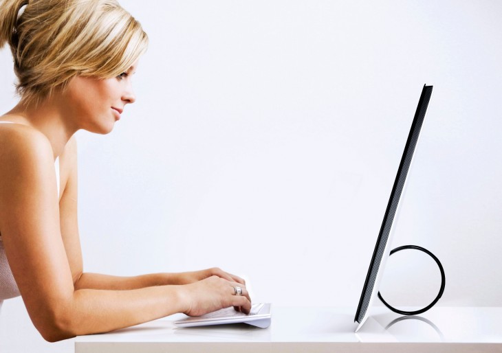 Woman working on the computer with a glass of juice