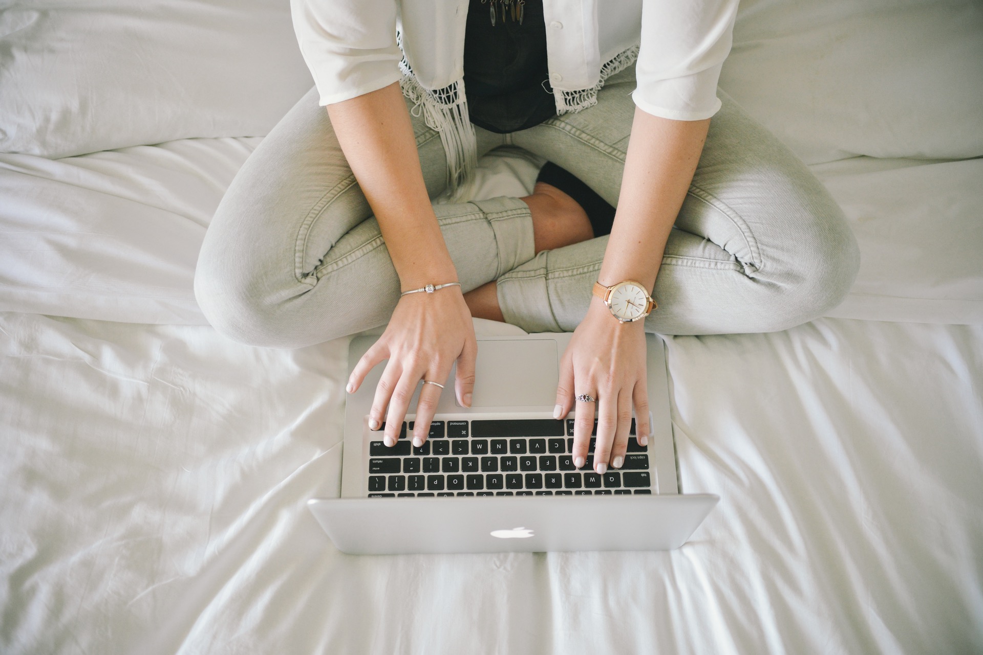 Woman Working In Bed