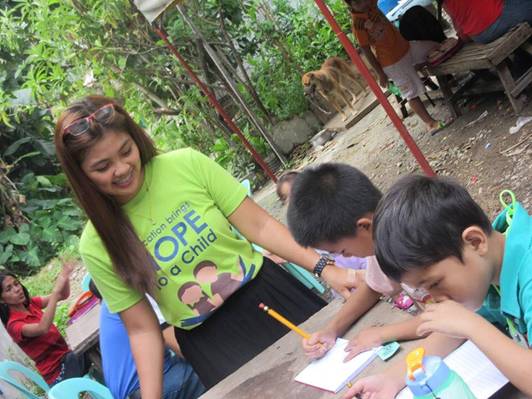 A Smiling Volunteer with Kids