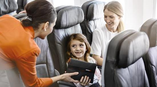 Jetstar crew member accommodating guests