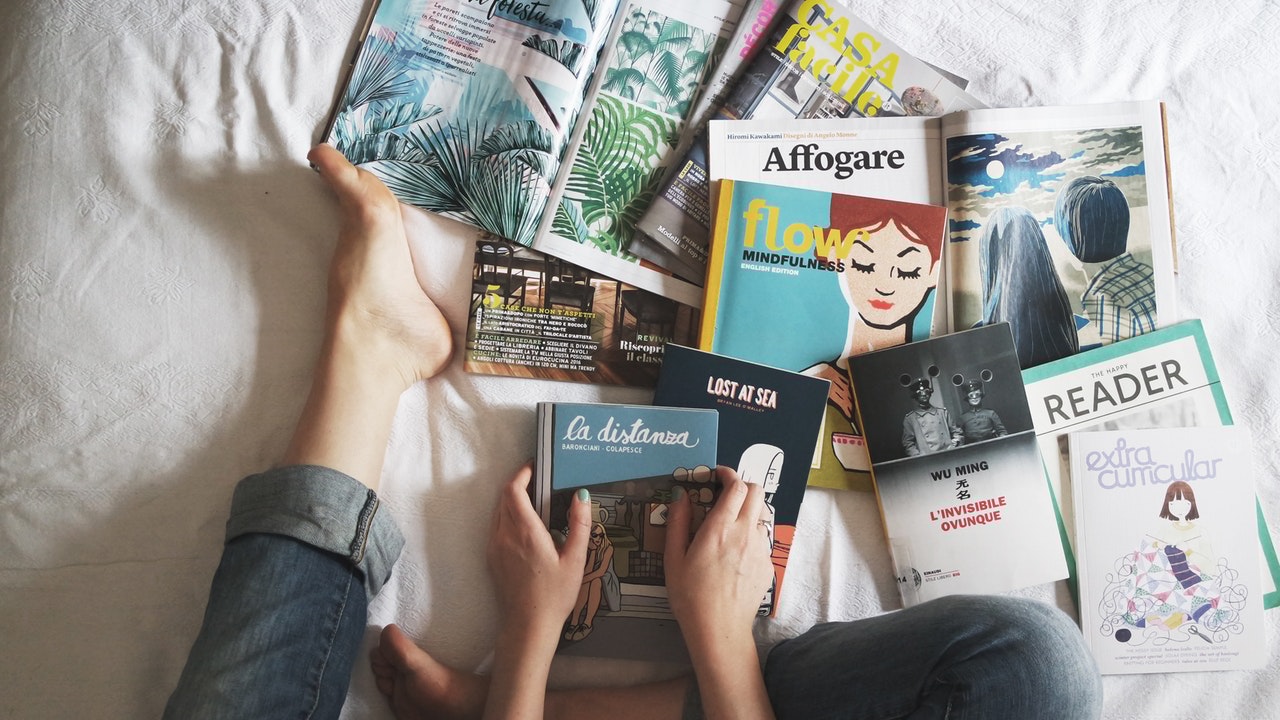 Magazines and Books on Bed