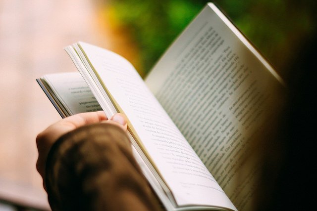 Woman Holding a Book