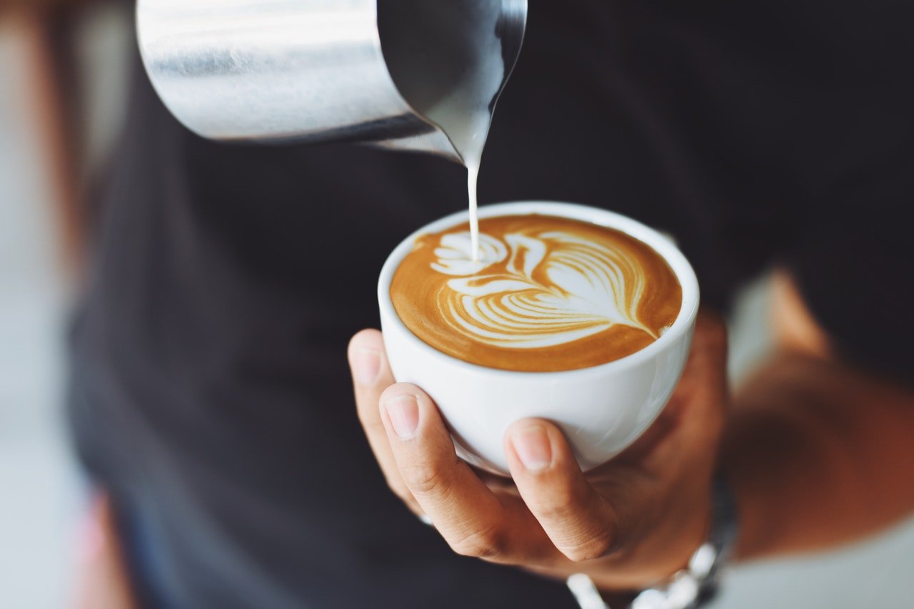 Coffee Being Prepared by a Barista