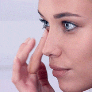 Woman Applying Eye Creme