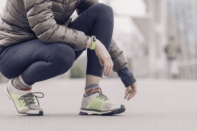 Woman with Jacket and Running Shoes