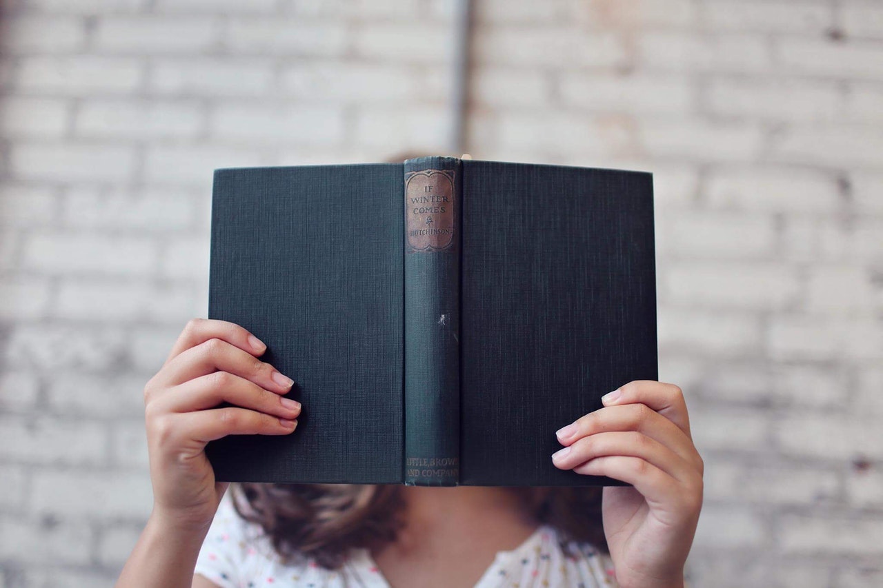 Woman Holding A Book