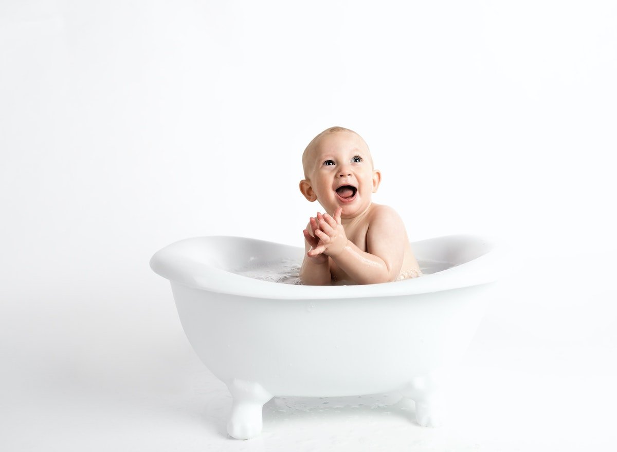 baby in a small bathtub