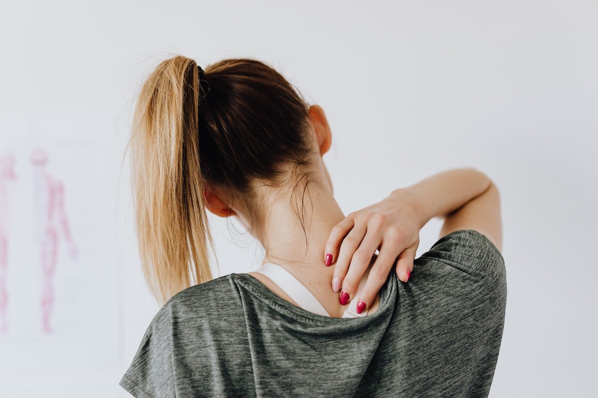 woman scratching her back