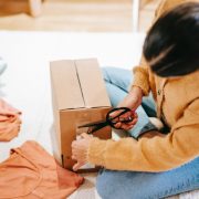 Woman cutting off adhesive tape