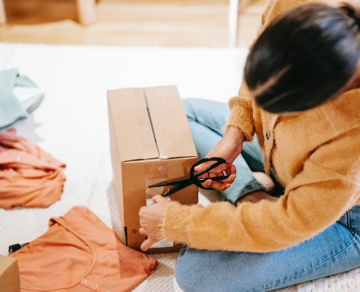 Woman cutting off adhesive tape
