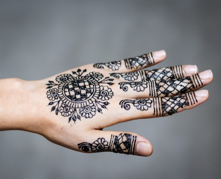 hand and finger tattoo