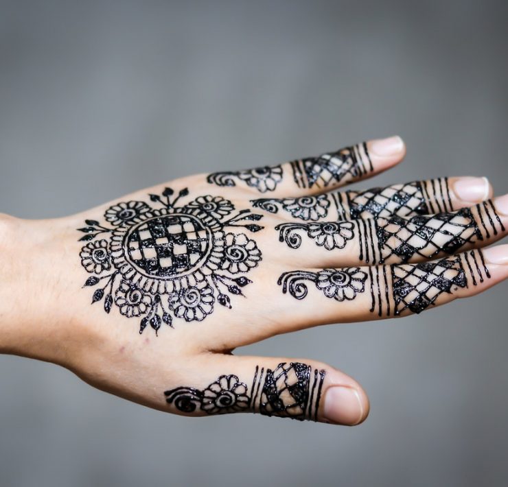 hand and finger tattoo