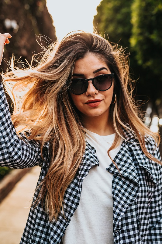 woman holding her hair