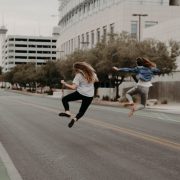 two woman jumping