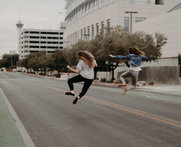 two woman jumping