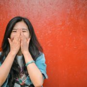 woman covering her face