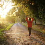 Woman walking on pathway during daytime