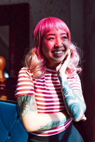 Smiling Woman in White and Red Striped Shirt