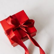 Red gift box tied with ribbon
