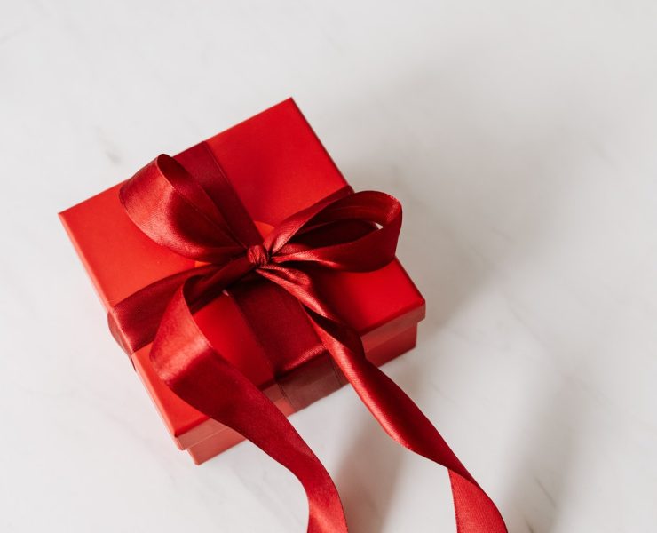 Red gift box tied with ribbon
