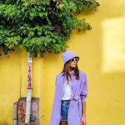 A woman wearing purple sun hat