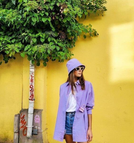 A woman wearing purple sun hat