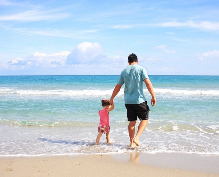father and daughter at the beach
