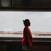 Standing woman wearing a facemask