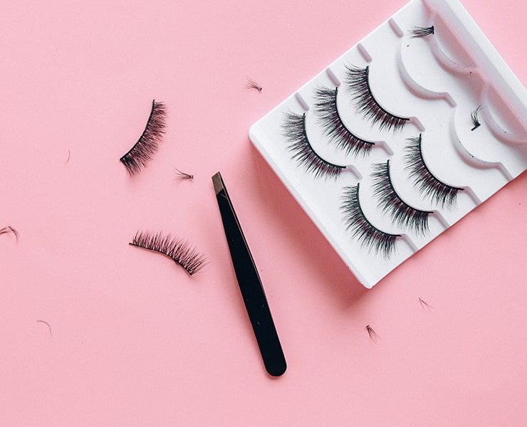 False Eyelashes on Pink Surface