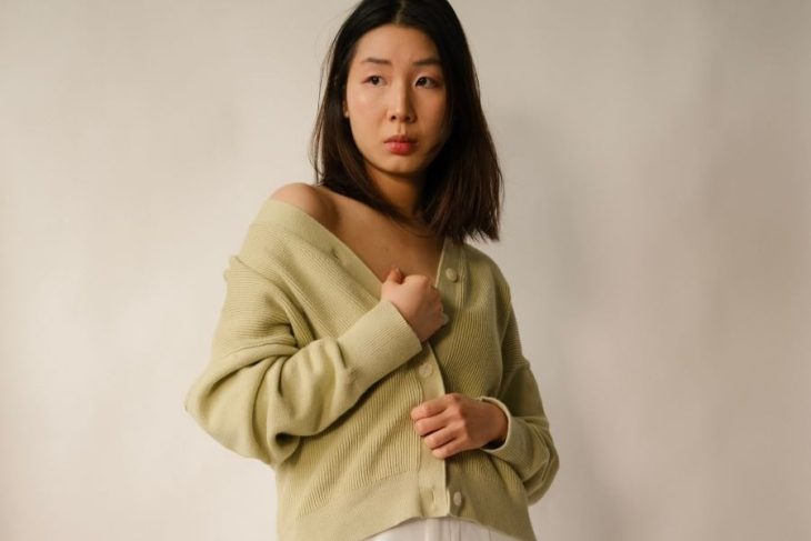 asian woman wearing cardigan