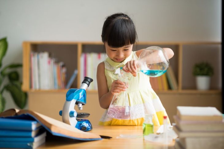 kid doing a science experiment