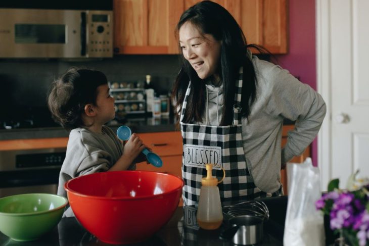 mother and baby baking together