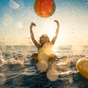 woman splashing ocean water