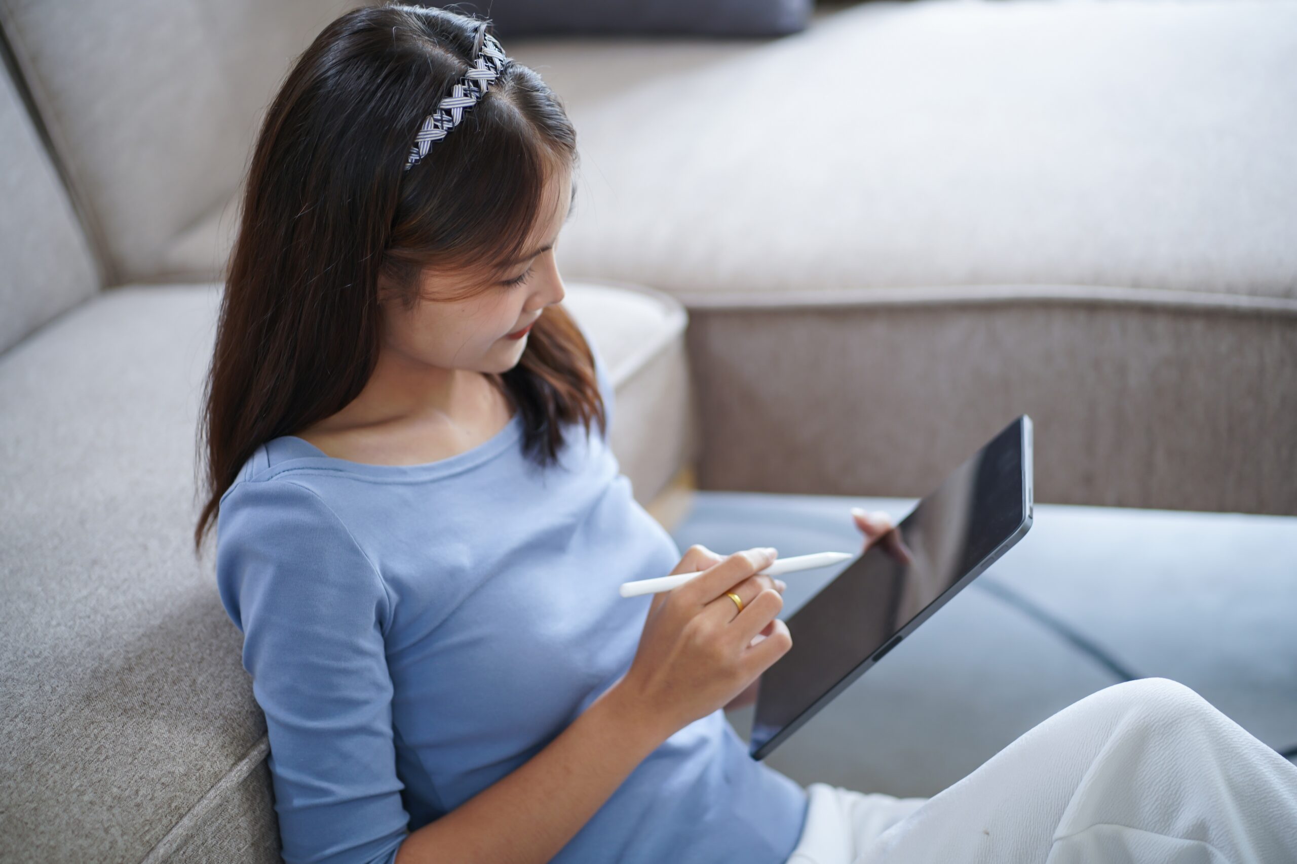 a woman playing games on her tablet
