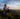 a woman watching the view from a mountain