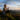 a woman watching the view from a mountain