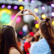 two girls forming a heart