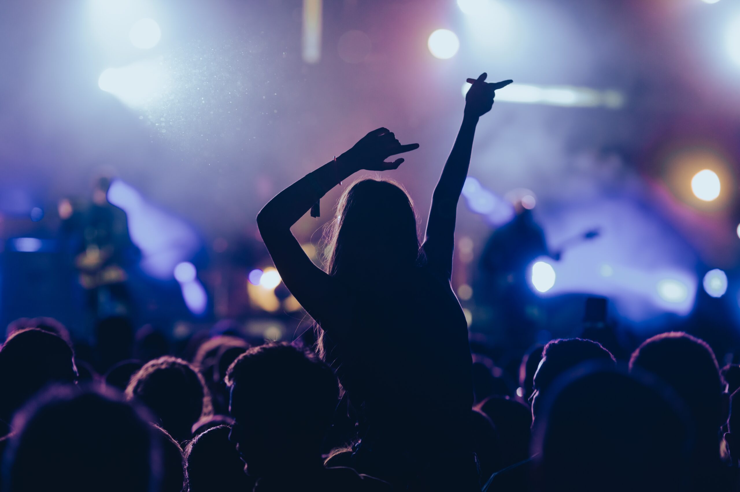 a woman in the audience singing along