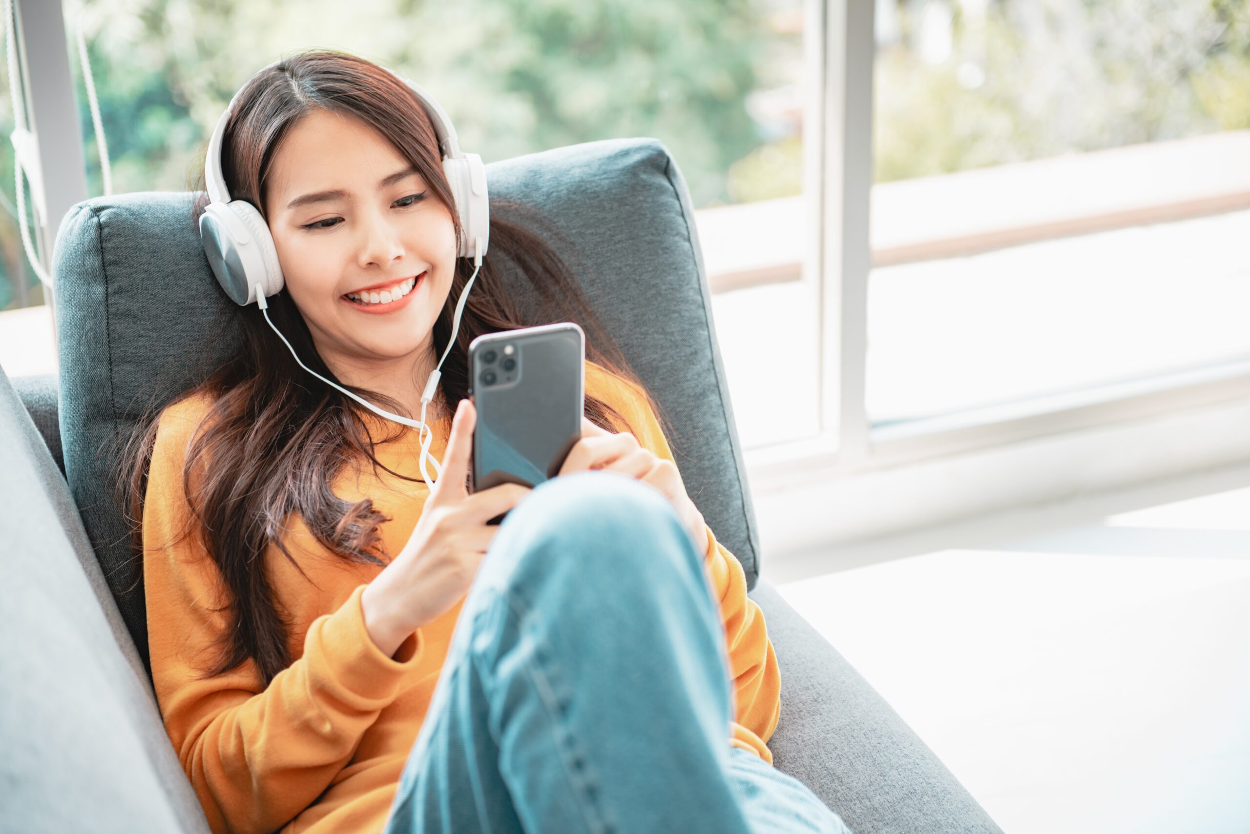 a woman listening to a podcast 