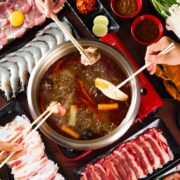 hotpot set up with people eating