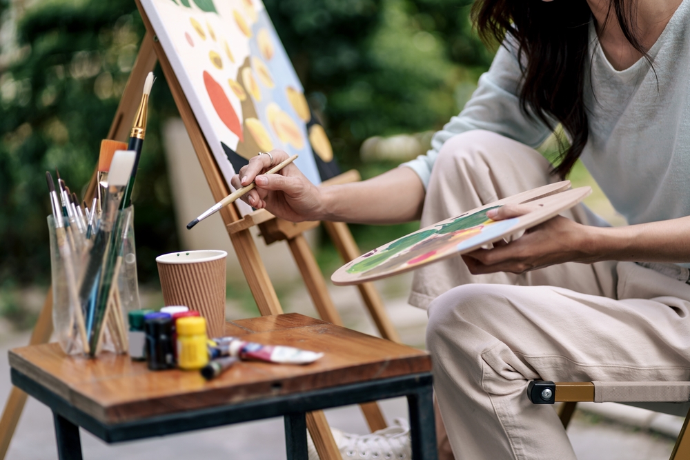 a young woman painting