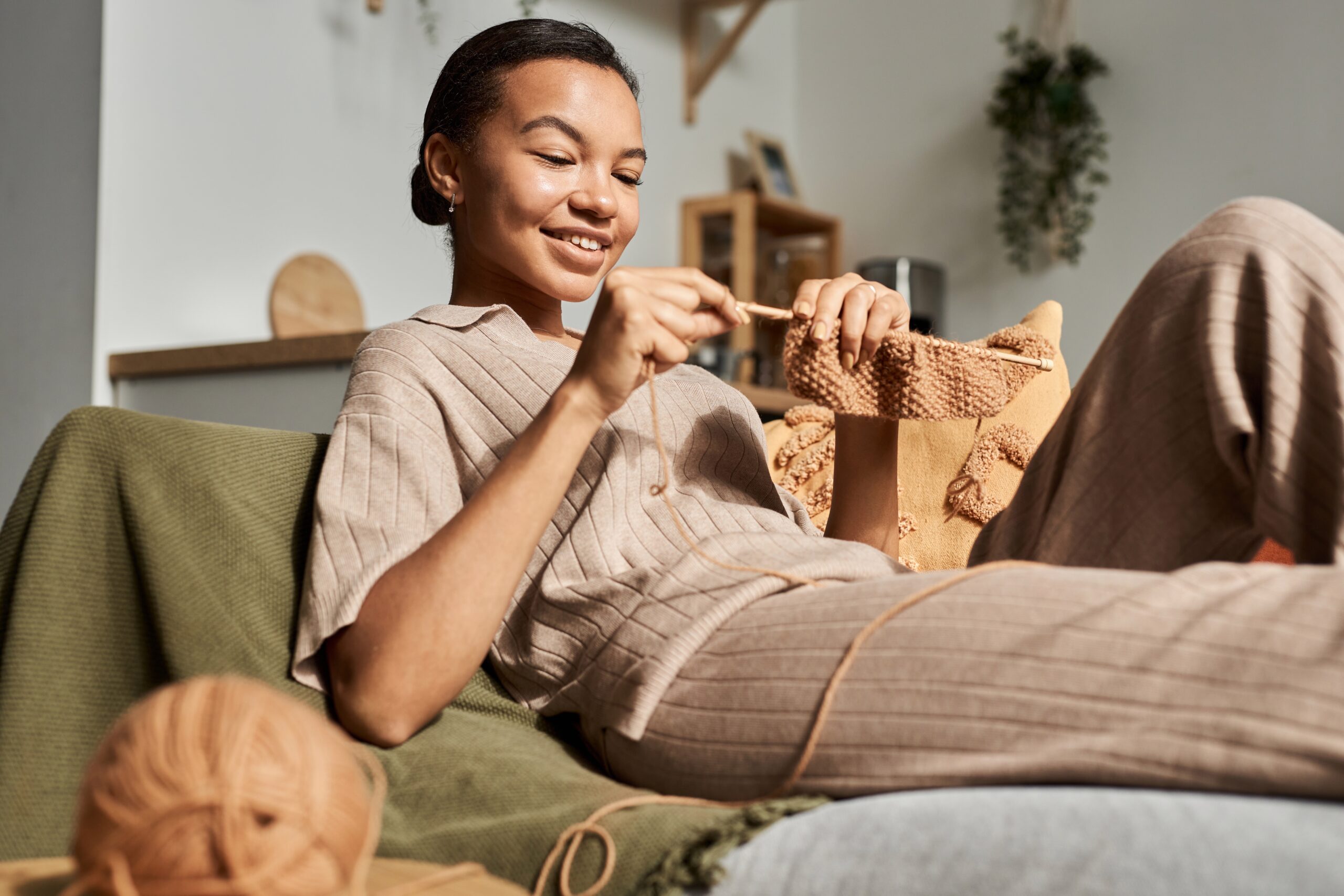 a young woman crocheting