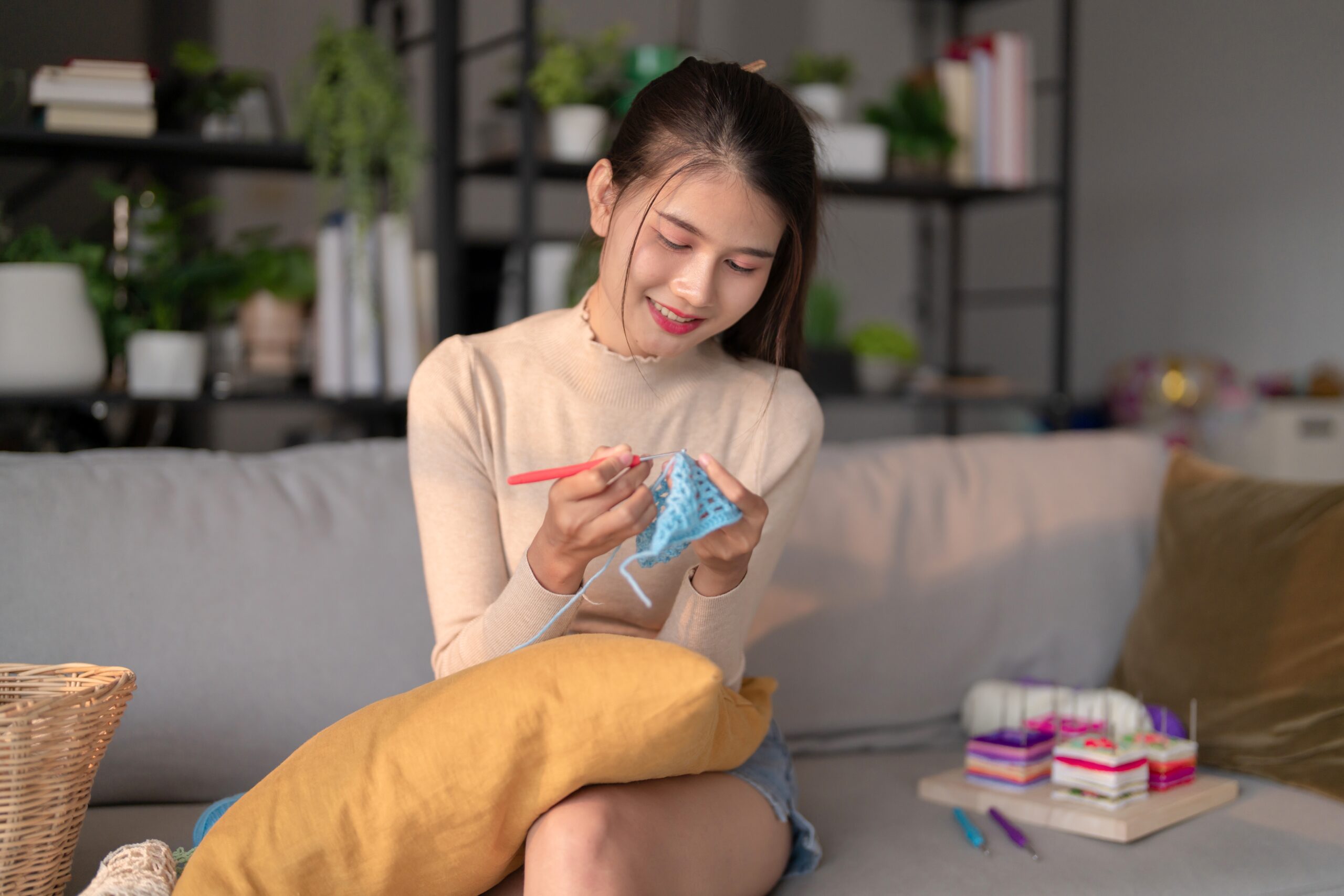 a young woman crocheting