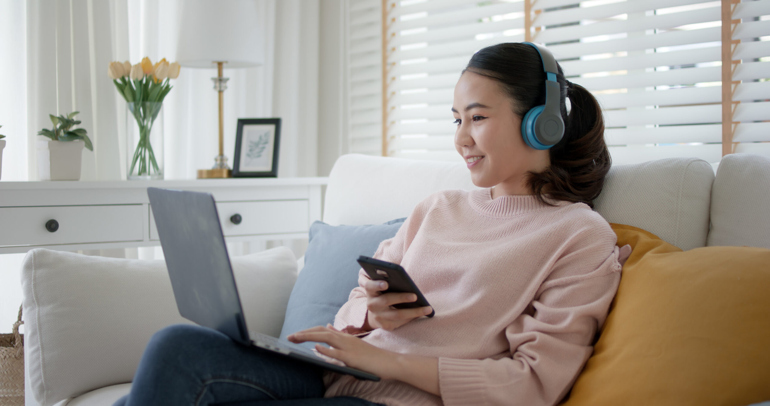 a woman watching a film on her laptop