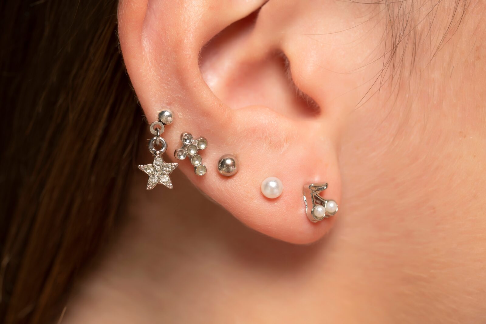 different ear piercing designs on an ear