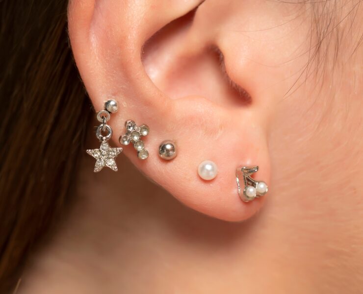 different ear piercing designs on an ear
