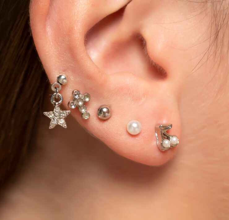different ear piercing designs on an ear