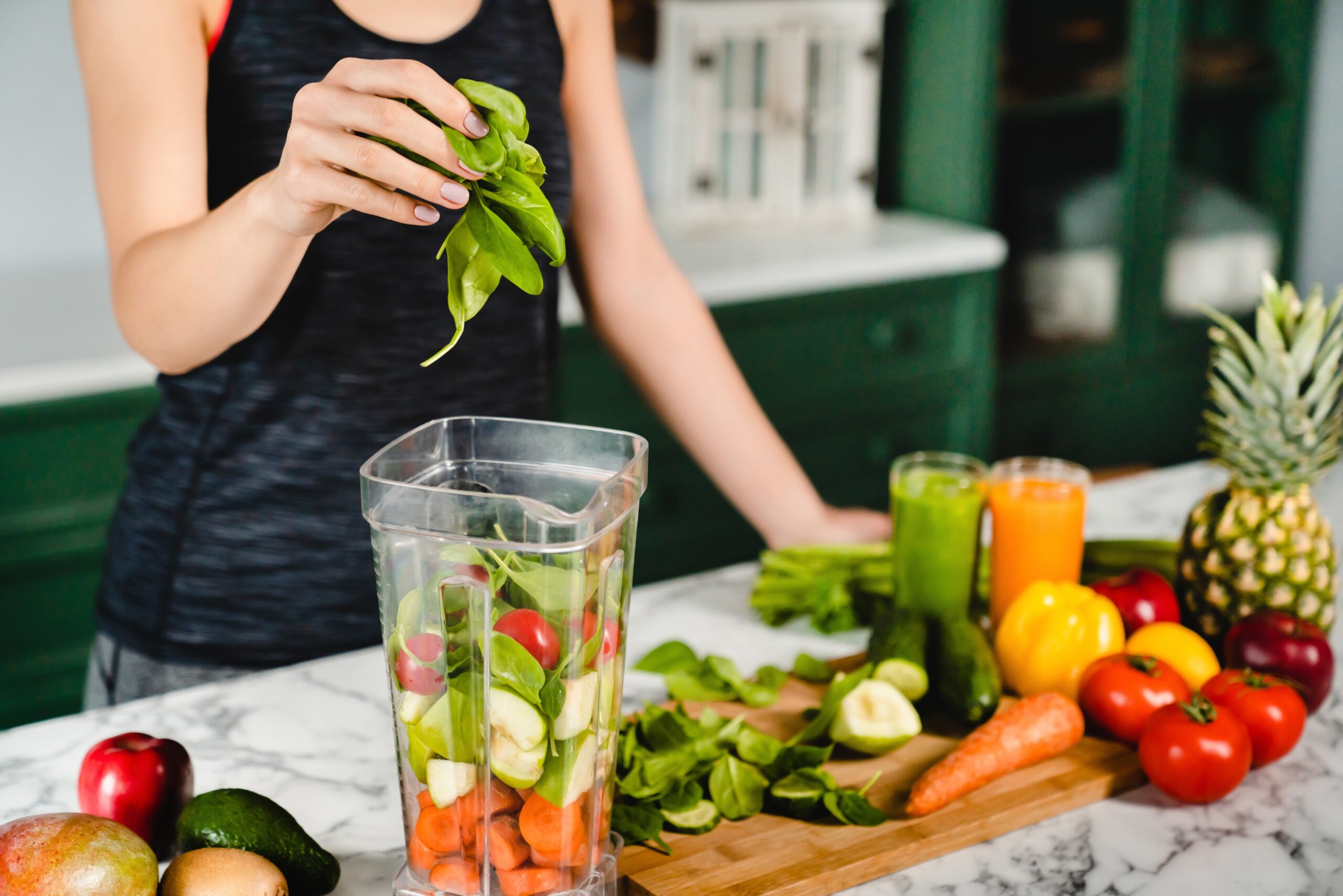 a woman making a plant-based drink