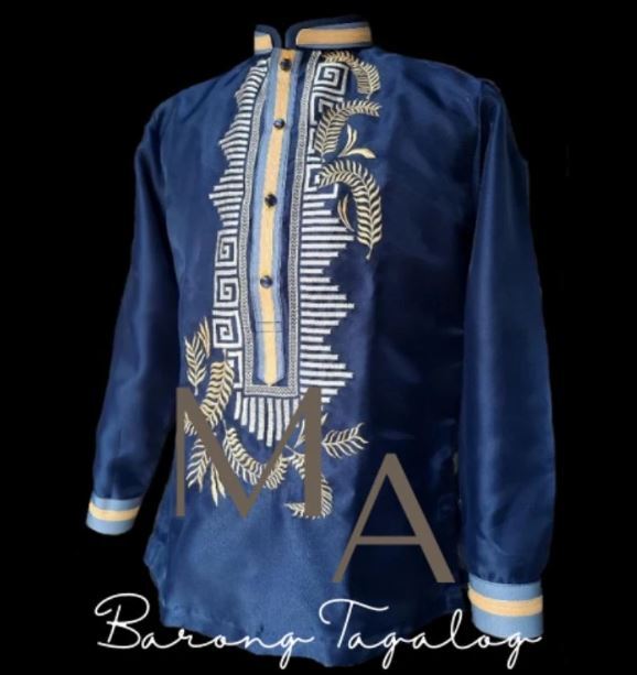 A blue long-sleeved Barong Tagalog featuring gold and white geometric embroidery down the front placket.